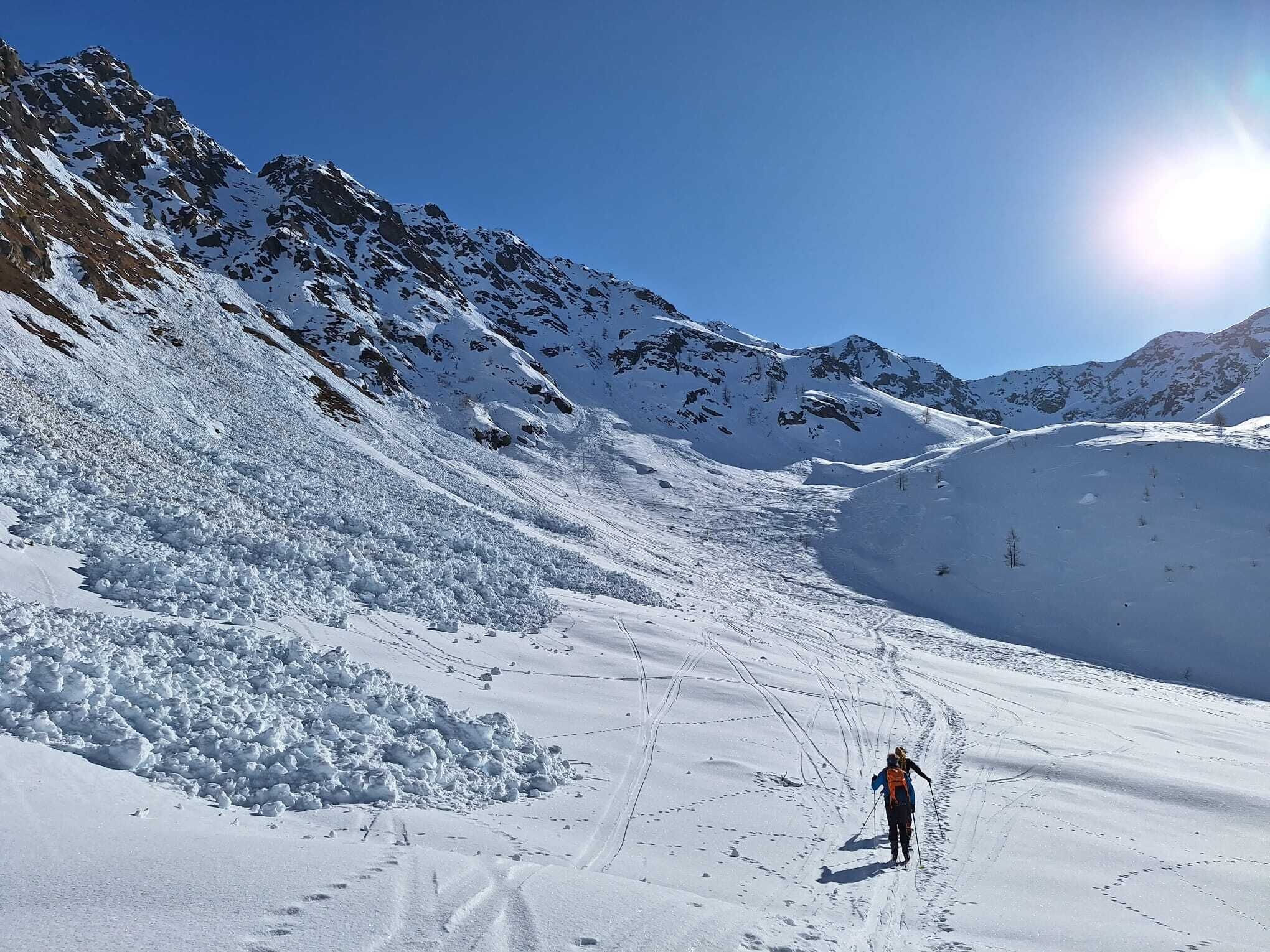 A snowy mountain landscape with a clear sky.