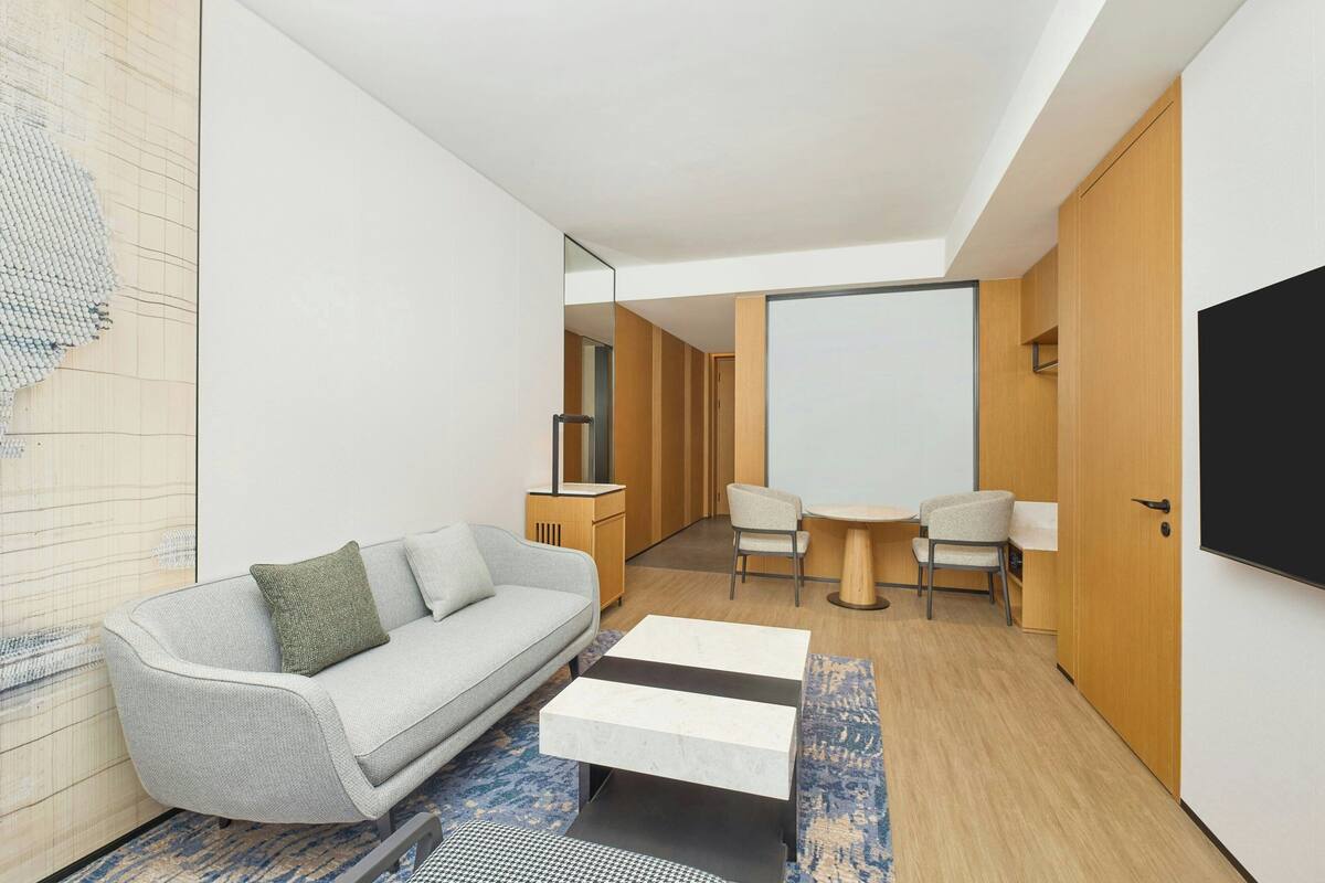Comfort Suite, 1 King Bed, City View | Living room | LCD TV