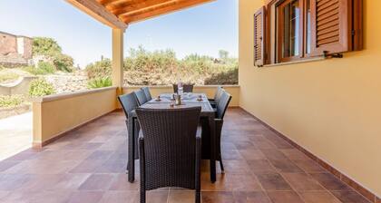 GuestHost - A welcoming and spacious 100-square-meter villa, perfect for seven people, featuring a private entrance and private outdoor parking for two vehicles.The property is located in Nuraxi Figus, a quiet hamlet of Gonnesa: from here, guests can vis