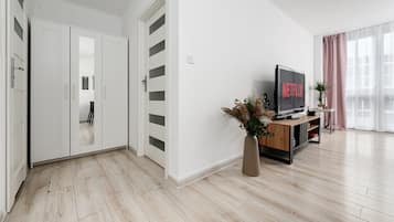 Comfort Apartment | Living area | 40-inch flat-screen TV with cable channels
