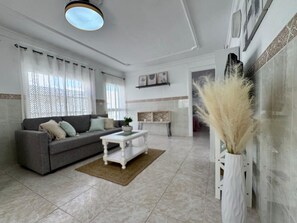 Departamento Confort, vista a la ciudad | Área de sala de estar