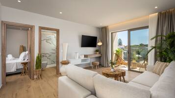 Suite Deluxe, vistas a la piscina | Zona de estar