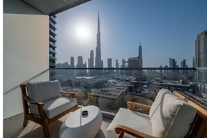A balcony with a city view, including a prominent skyscraper. - Khalifa View 5 Star Direct Dubai Mall (Dubai)
