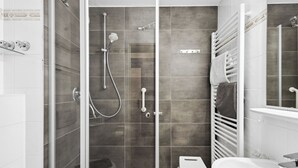 A modern bathroom with a glass-enclosed shower, a white bathtub, and a white sink. - Cozy and quiet vacation apartment in the center of Bad Füssing (Bad Füssing)