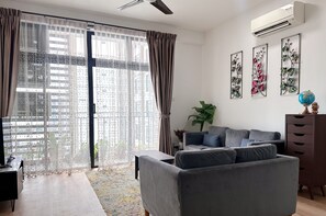 City Apartment, Ocean View | Living area | 55-inch flat-screen TV with cable channels - Citywoods Apartment By Antlerzone (Johor Bahru)