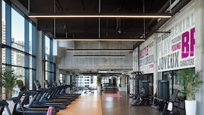 A gym with treadmills, weight machines, and a motivational wall. - Moxy Ottawa Downtown (OTTAWA)