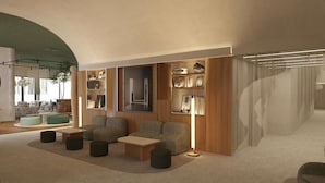 A modern living room with a sofa set, a coffee table, and a bookshelf. - ibis Styles Zumaia Zestoa (Zestoa)