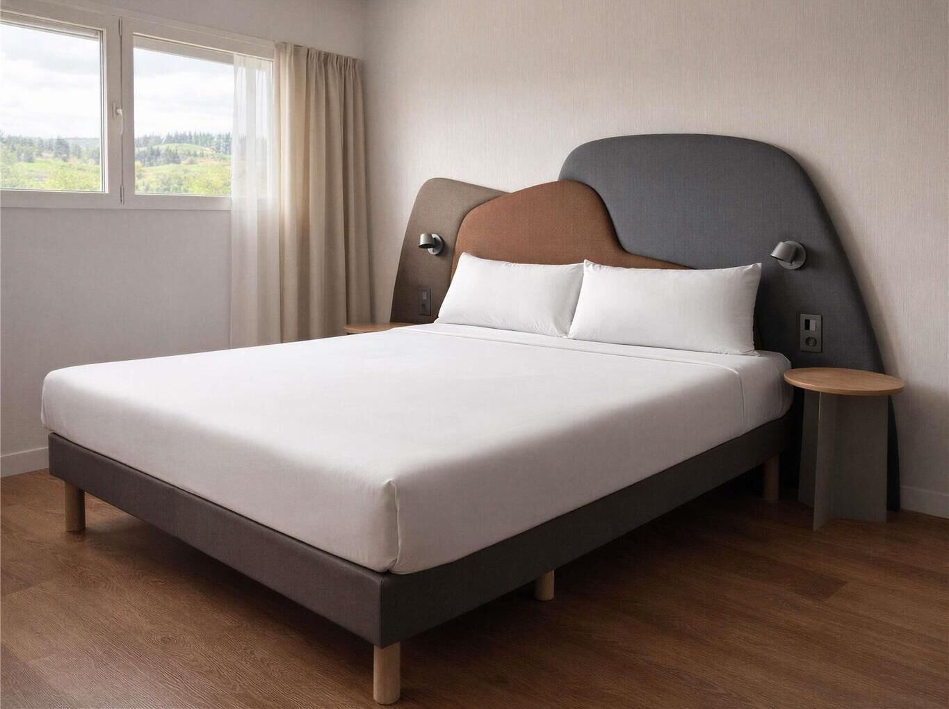 A modern hotel room with a large bed, a nightstand, a wall-mounted lamp, and a window with curtains.