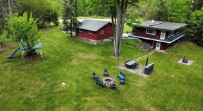 Outdoor dining - Creek Cottage: Private 4BR Retreat | ¼ mi to Lake (Boyne City)