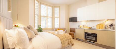 Individually furnished, desk, laptop workspace, iron/ironing board