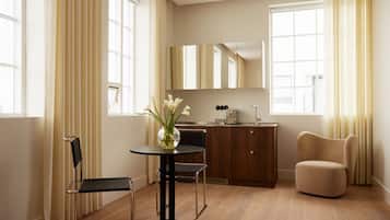 Fridge, stovetop, dishwasher, coffee/tea maker