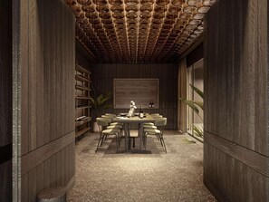 A room with a wooden ceiling, a dining table with chairs, a wine rack, and a large framed picture on the wall. - Nirema Hotel & Spa Samos - Mgallery Collection (Samos)