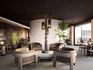 A modern interior with a central seating area, a textured wall, and a large window. - Nirema Hotel & Spa Samos - Mgallery Collection (Samos)