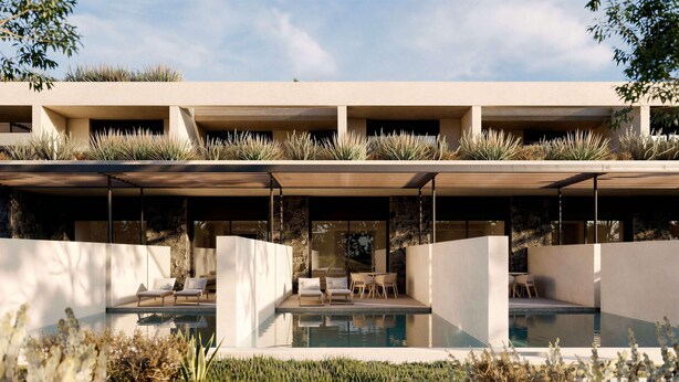 Un edificio moderno con zona de piscina, mobiliario exterior y fachada de piedra.