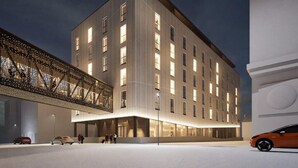 A modern building with a flat roof, large windows, and a covered entrance area. - Santa's Hotel Noelle (Rovaniemi)