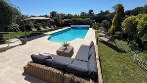 A swimming pool with lounge chairs, a wicker sofa, and a pergola. - Beautiful Villa in private estate with 5 bedrooms, swimming pool, panoramic view (Villeneuve-Loubet)