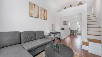 Studio Suite, Balcony, Mezzanine | Living area | 32-cm Smart TV with digital channels