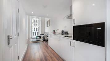 Studio Suite, Balcony, Mezzanine | Living area | 32-cm Smart TV with digital channels