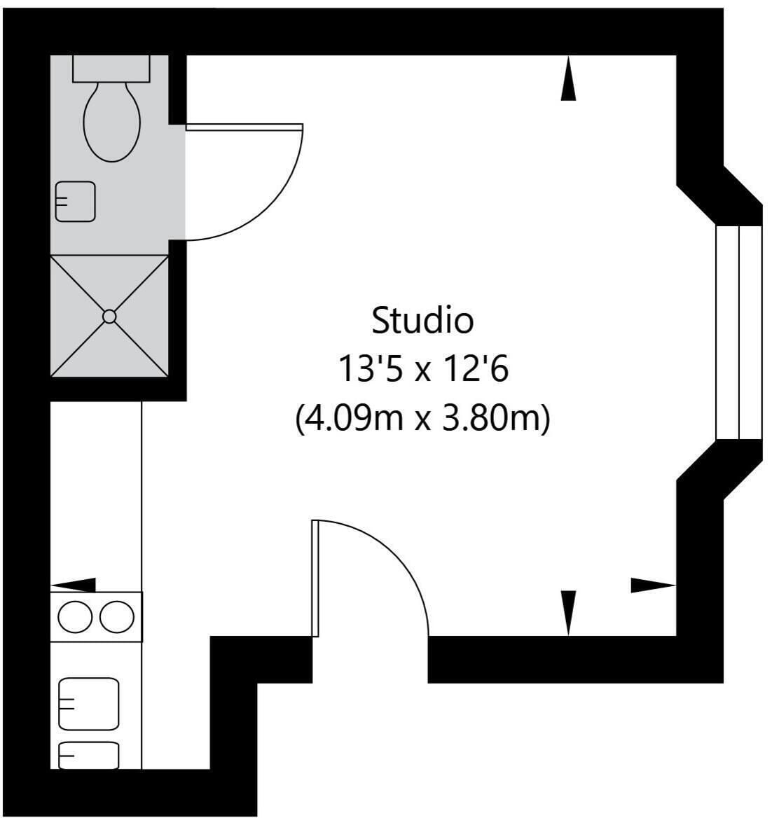A studio apartment layout measuring 13'5 x 12'6 (4.09m x 3.80m) with a kitchenette, bathroom, and a curved living area.