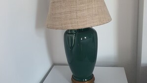 A green ceramic lamp with a beige lampshade on a white square table. - Room-charming Boutique Guest Retreat in (Chiang Mai)