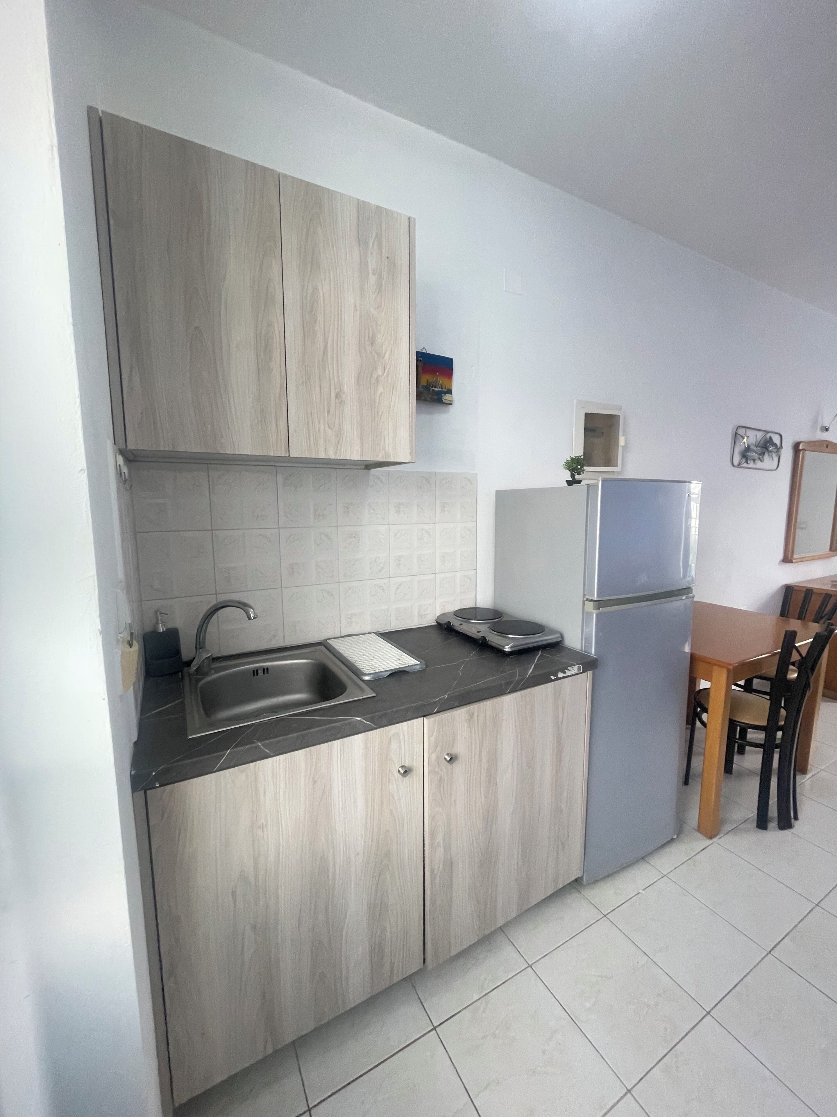 Apartment, Balcony | Private kitchen | Full-size fridge, stovetop, cookware/dishes/utensils