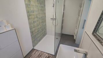 Shower, hair dryer, towels, soap