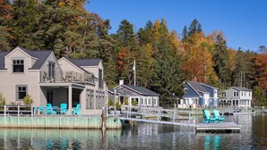 A waterfront property with a dock, a covered porch, and a small building. - Chester Back Harbour Exclusive providing direct access to water via private dock (Chester Basin)