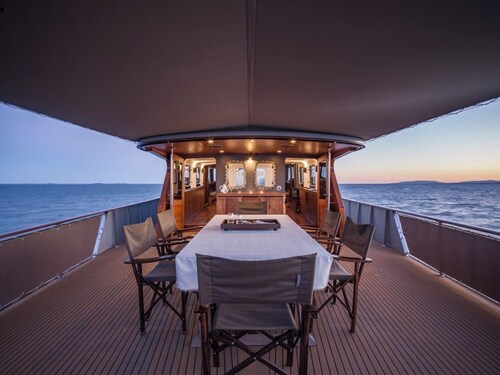 Relax on a stunning classic super yacht in a soothing waterfront setting