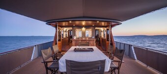 Relax on a stunning classic super yacht in a soothing waterfront setting