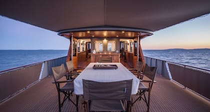 Relax on a stunning classic super yacht in a soothing waterfront setting