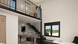 Ein modernes Schlafzimmer mit einem großen Bett, einem Holztisch, einer Treppe und Blick ins Freie.
