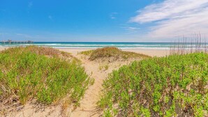 A beach path leading to the ocean with dunes and vegetation. - JL #261 | The Beach House | Oceanfront | Ocean Views (South Nags Head)