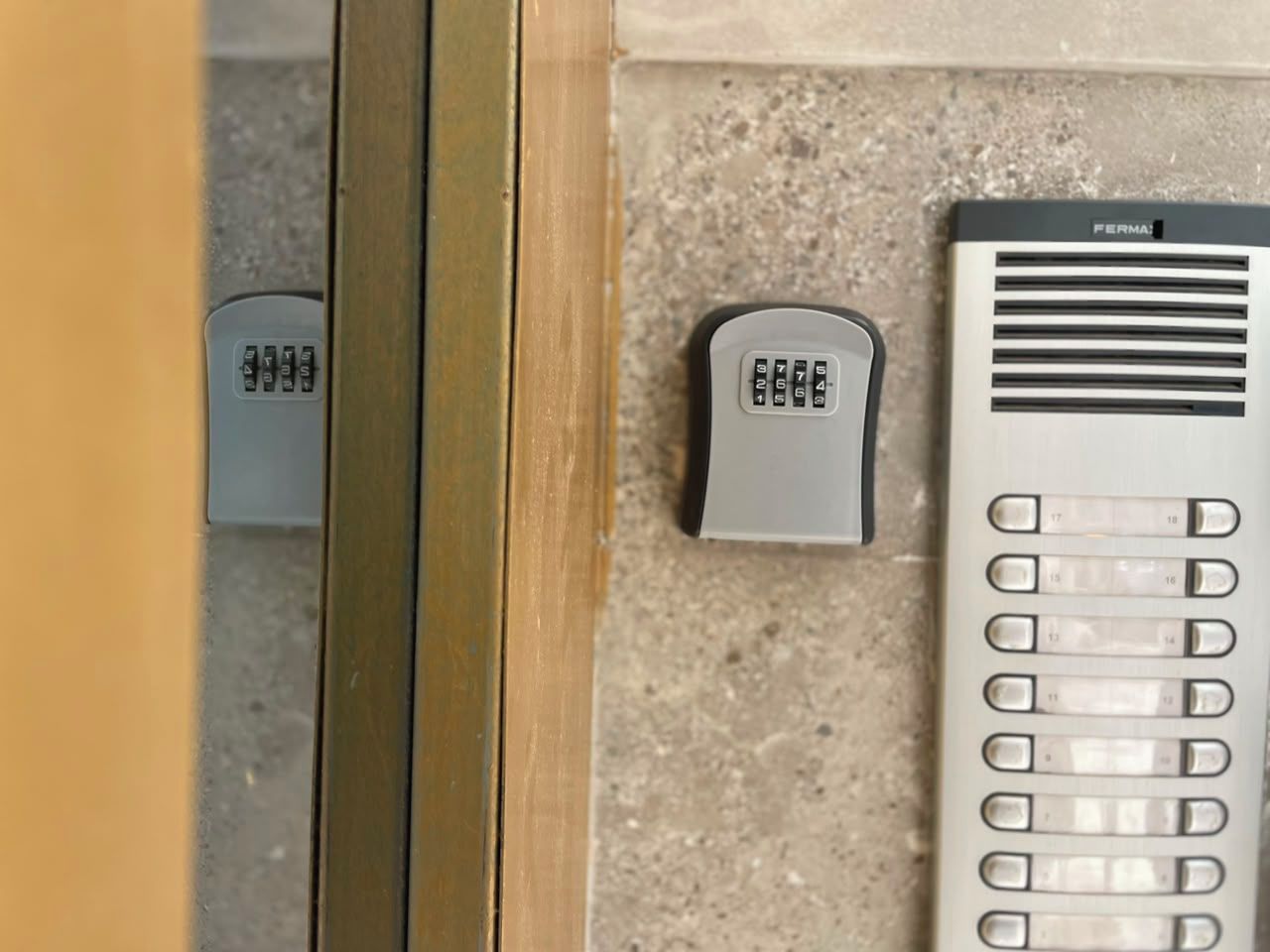 A door with a keycard reader and a keypad lock.