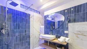 A modern bathroom with a shower, a sink, and a mirror. - Flowery Rainbow (Rome)