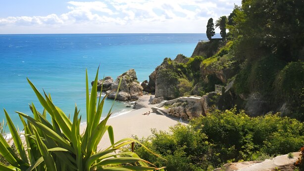 A coastal landscape with a beach, rocky cliffs, and vegetation. - Holiday Home 'Los Naranjos' with Shared Pool, Wi-Fi and Air Conditioning (Nerja)