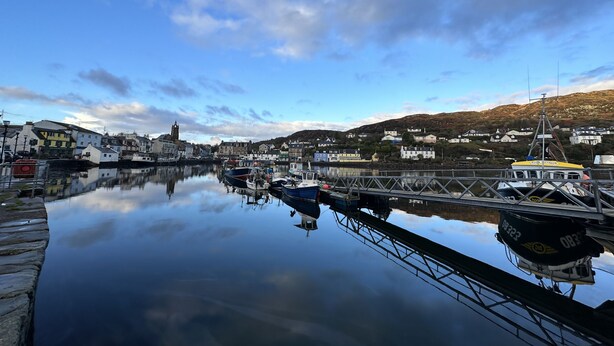 A harbor with boats, a bridge, and buildings along the waterfront. - Romantic Secluded Cosy Stone Cottage Beside the West Loch, Beautiful Argyll (Tarbert)