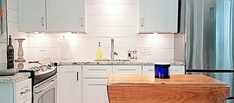 1 bedroom apartment with wood burning stove and paver patio, en suite laundry