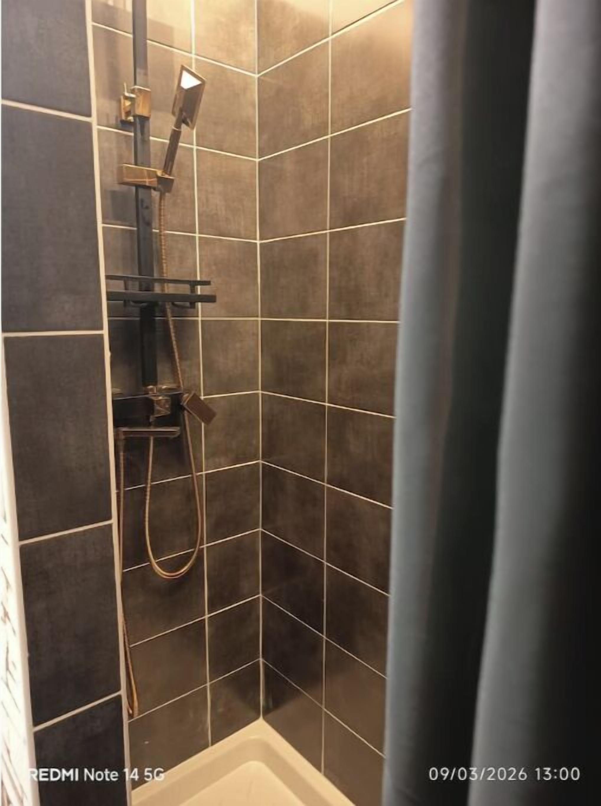 Shower, towels, soap, toilet paper