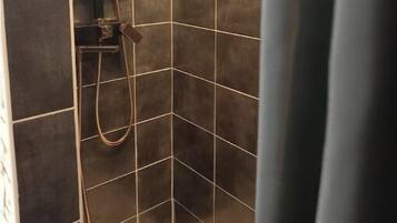 Shower, towels, soap, toilet paper
