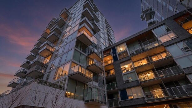 A modern high-rise building with multiple balconies and large windows. - West Coast City Living (Victoria)