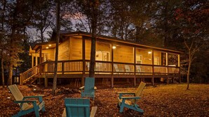 A wooden cabin with a deck, surrounded by trees. - Fabulous Frog! (Murphy)