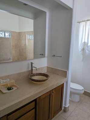 A bathroom with a beige countertop, a round basin, a mirror, a toilet, and a shower curtain. - 3 Bdm 2 Storey Penthouse Palapa Ocean View (Bajos de Chila)