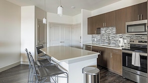 Apartment (1 Bedroom) | Private kitchen | Fridge, microwave, oven, stovetop