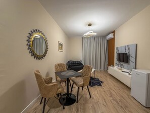 Apartamento, 1 quarto, vista para a cidade | Área de estar