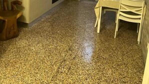 A compact kitchen with a dining area, a small table, and chairs. - ines downtown (Rome)