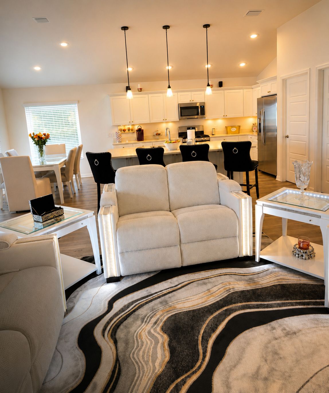 A modern living room with a sofa, a coffee table, and a rug.