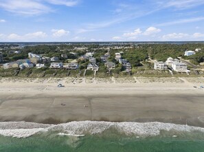 A coastal residential area with beachfront properties, sandy beach, and ocean waves. - Second Row Ocean View Retreat w/ Pool and Elevator (Emerald Isle)