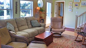 A living room with a sofa, chairs, a coffee table, and a rug. - 3rd Row Home, Elevator & Ocean View (Emerald Isle)