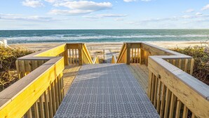 A wooden boardwalk leading to a beach with a clear view of the ocean. - Family Retreat with Hot Tub & Game Room and Short Walk to Beach (Emerald Isle)