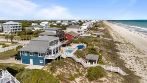 A coastal residential area with houses, a beach, and a clear sky. - Dog-friendly 5BR Beach Home with Pool & Ocean Views (Emerald Isle)